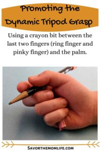 Promoting the Dynamic Tripod Grasp. Using a crayon bit between the last two fingers (ring finger and pinky finger) and the palm.